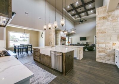 CW Custom Home Builders Symmetrical design layout between kitchen, dining, and great room example