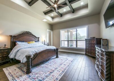 Gorgeous custom home bedroom with ceiling features