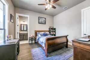 Bedroom and bathroom example in a custom home in South Central Texas