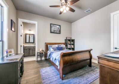 Bedroom and bathroom example in a custom home in South Central Texas