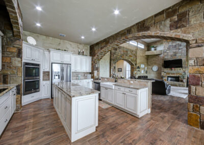 Stonework in country kitchen by custom home builder