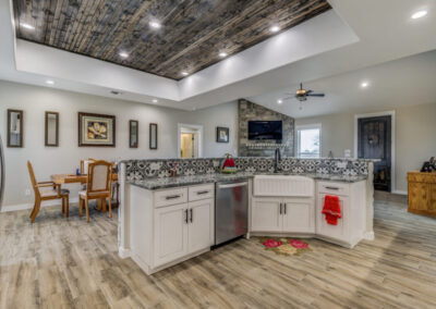 Beautiful kitchen with custom wood ceiling and tile.